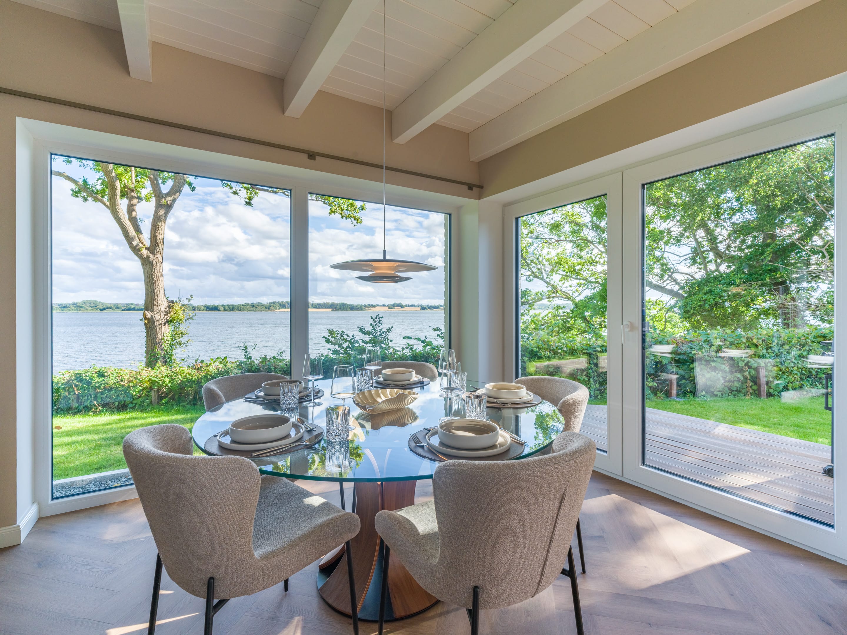 Dining table at the panoramic window with a view across the Schlei